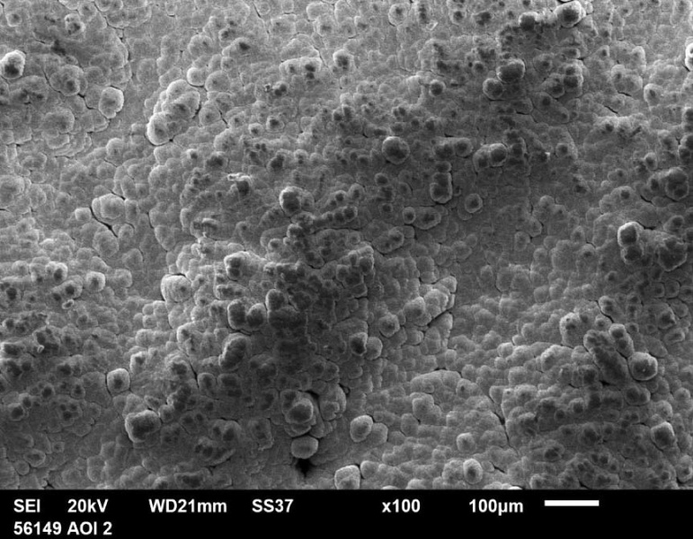 Рис. 15. Микрофотография поверхности образца многослойного материала,  полученного методом СЭЛС с нанесенным на него покрытием